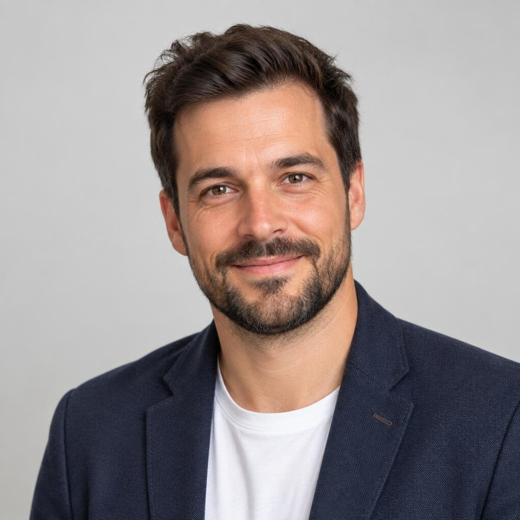 Studio portrait of a Belgian man in his 30s with a short beard