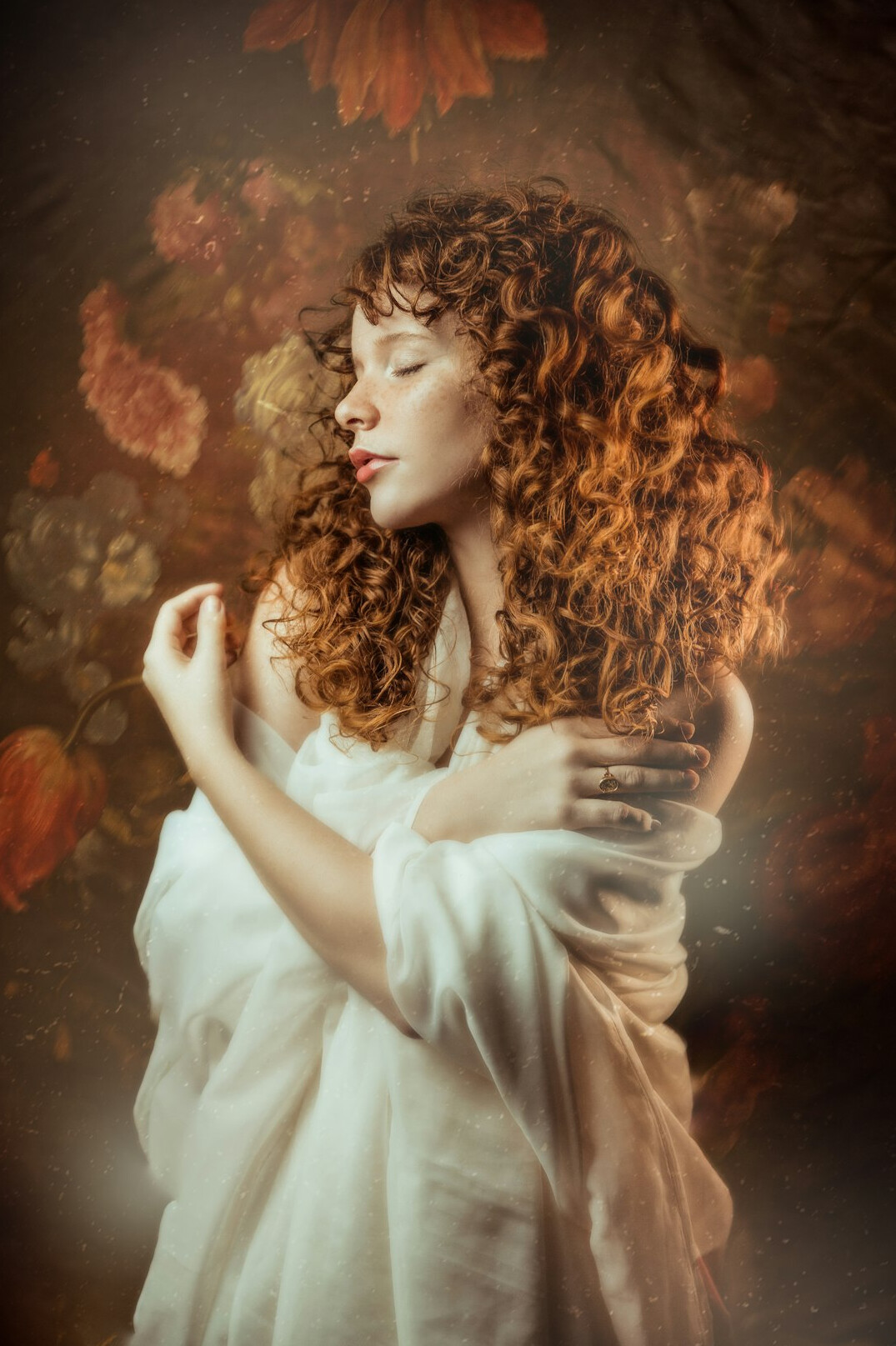 Studio portrait of a young Belgian woman with curly dark hair